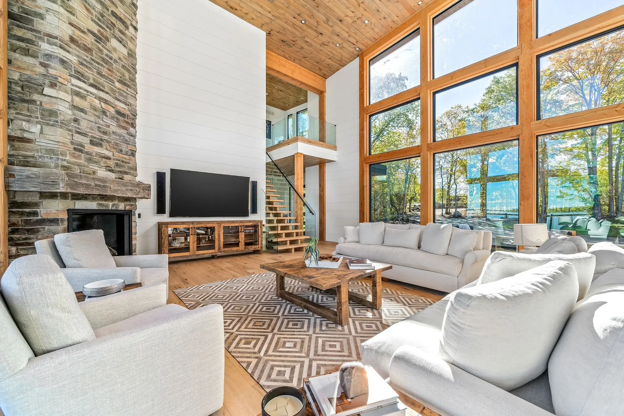 The View on Balsam: great room seating area facing the floor-to-ceiling stone fireplace
