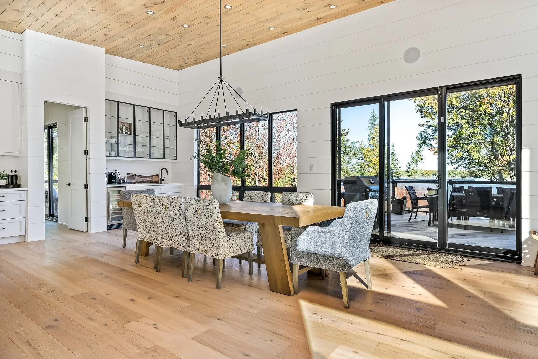The View on Balsam: dining area with live-edge table beside sliding patio doors