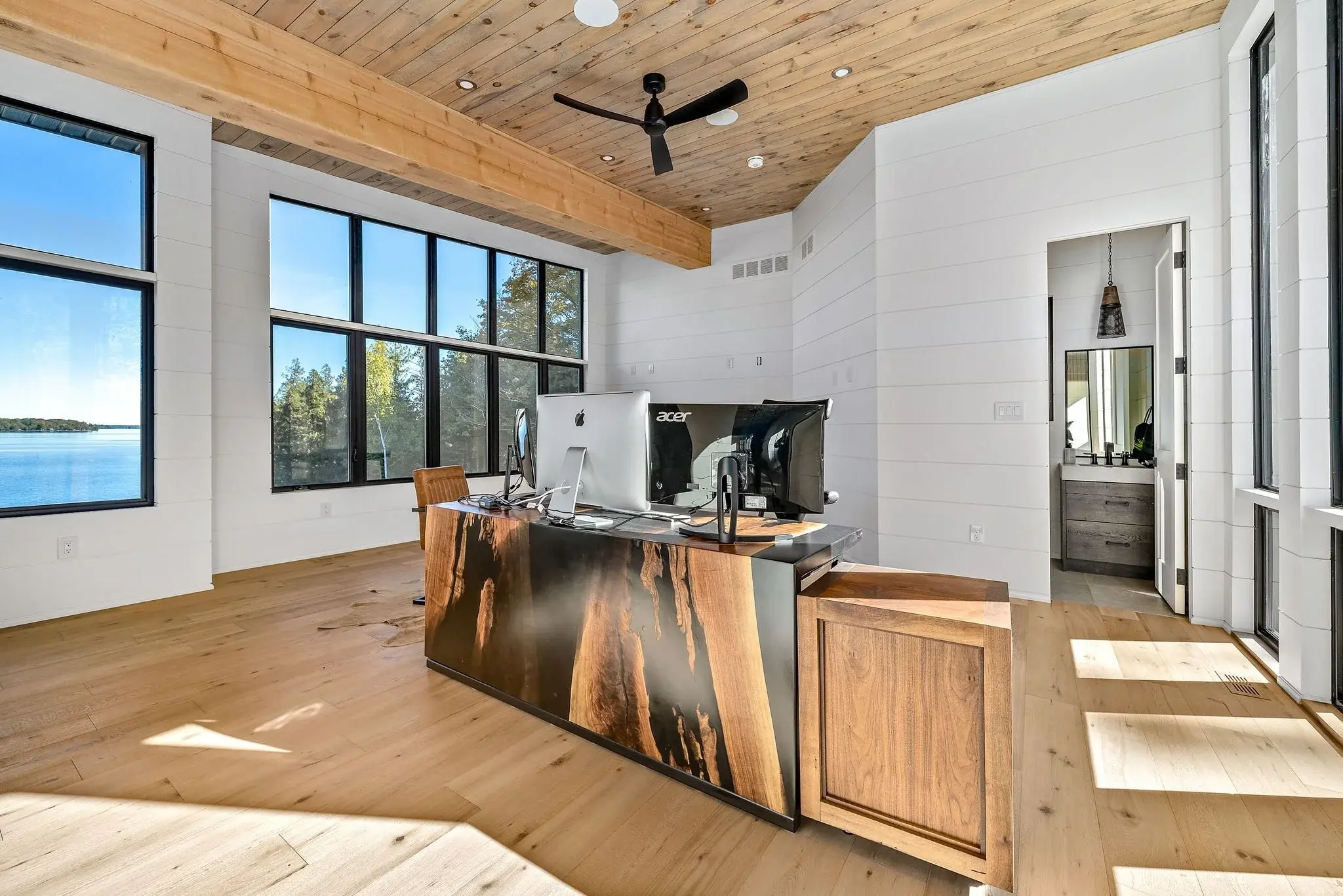 The View on Balsam: loft workspace with live-edge desk front and water view