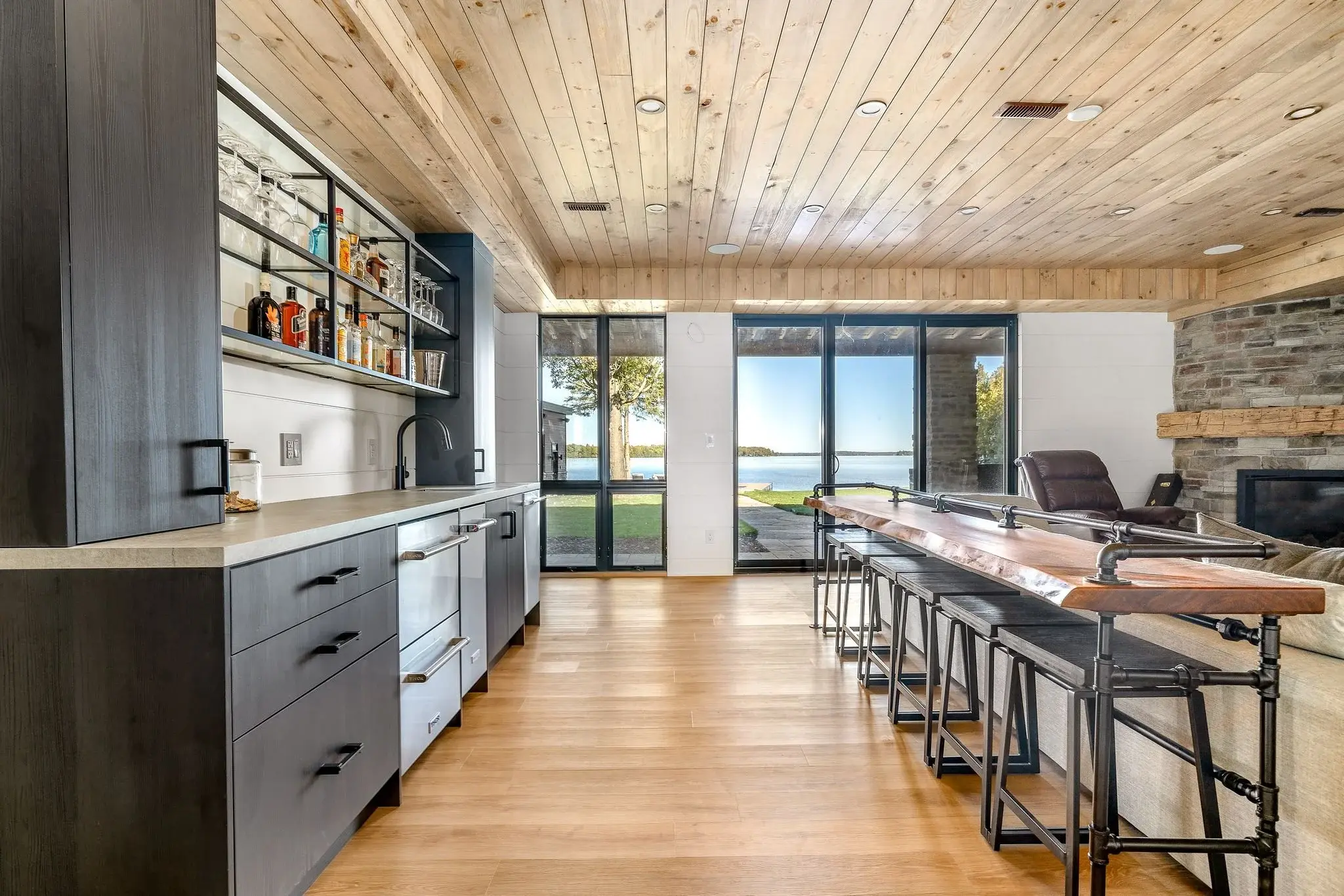 The View on Balsam: lower-level bar with wood ceiling and walkout lake view